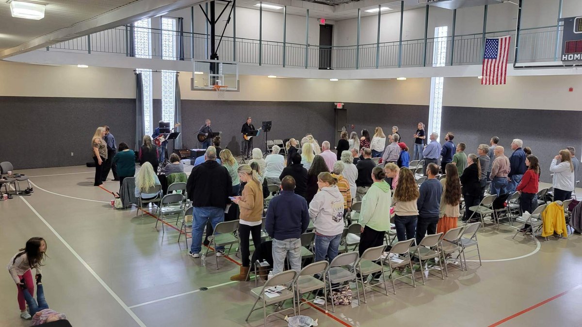 Wide view of the congregation seated for a Sunday service